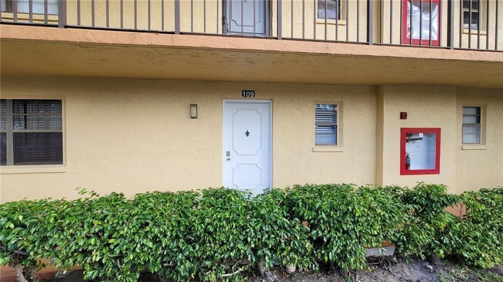 9273 Southwest 8th Street, Unit 109 Boca Raton, FL 33428 - Photo 19 of 22 a front view of a house