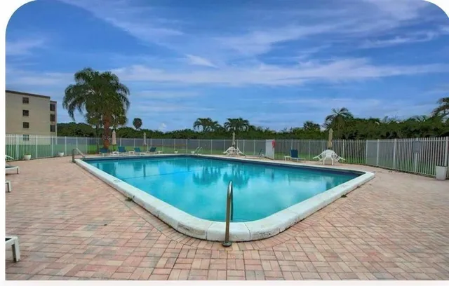a view of a swimming pool with a lake