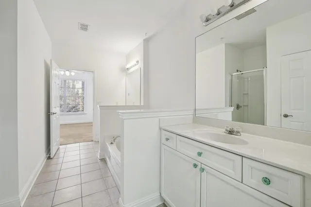 a bathroom with a sink a vanity and a mirror