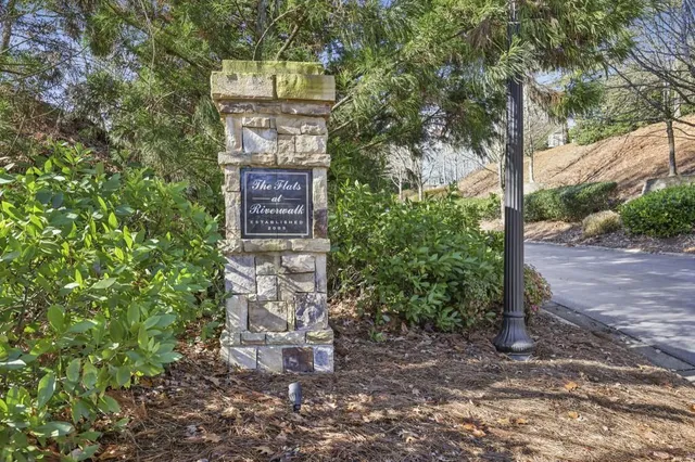 a sign board with a small yard