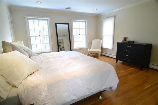 85 Westland Road Weston, MA 02493 - Photo 12 of 16 a large bed sitting in a bedroom next to a window