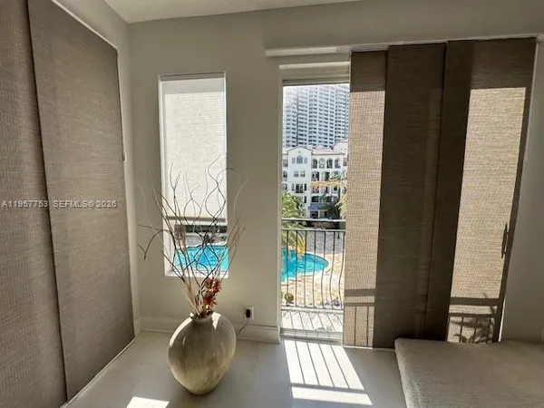 a spacious bedroom with a bed and couch