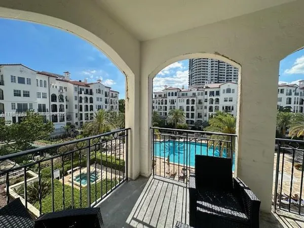 a room with furniture and a floor to ceiling window