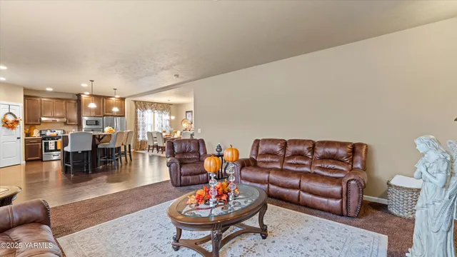 a living room with furniture kitchen and kitchen view