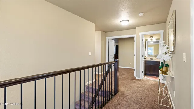 a view of a hallway view with staircase