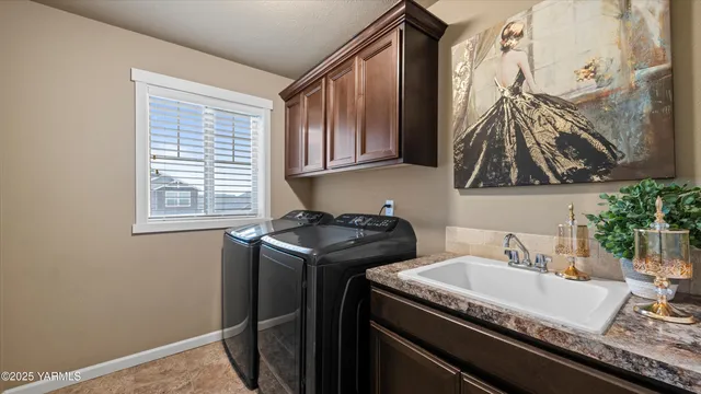 a kitchen that has a sink and a stove