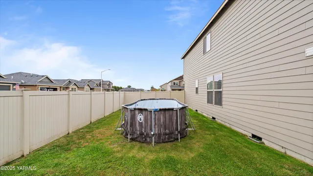 a view of a backyard with a tub