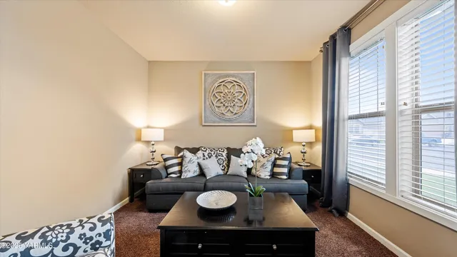 a living room with furniture and a window