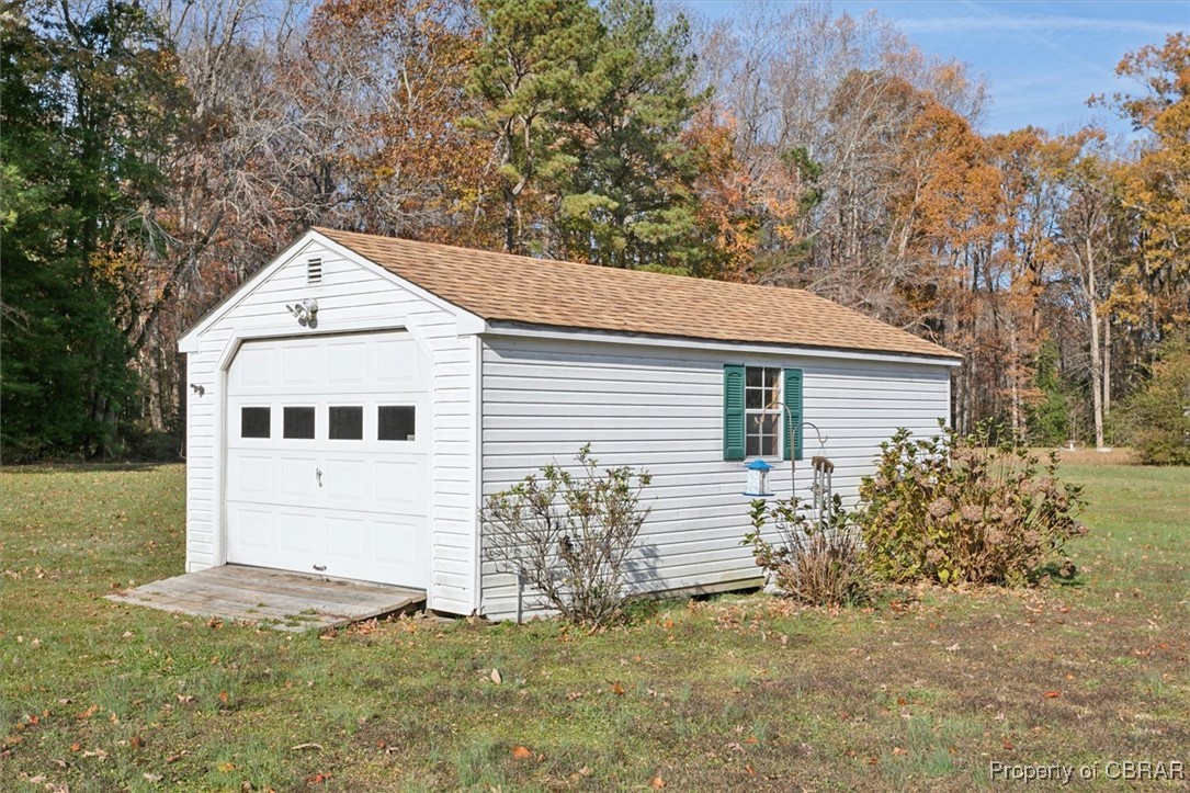 1413 Locust Grove Road Topping, VA 23169 - Photo 40 of 50 Garage with a lawn