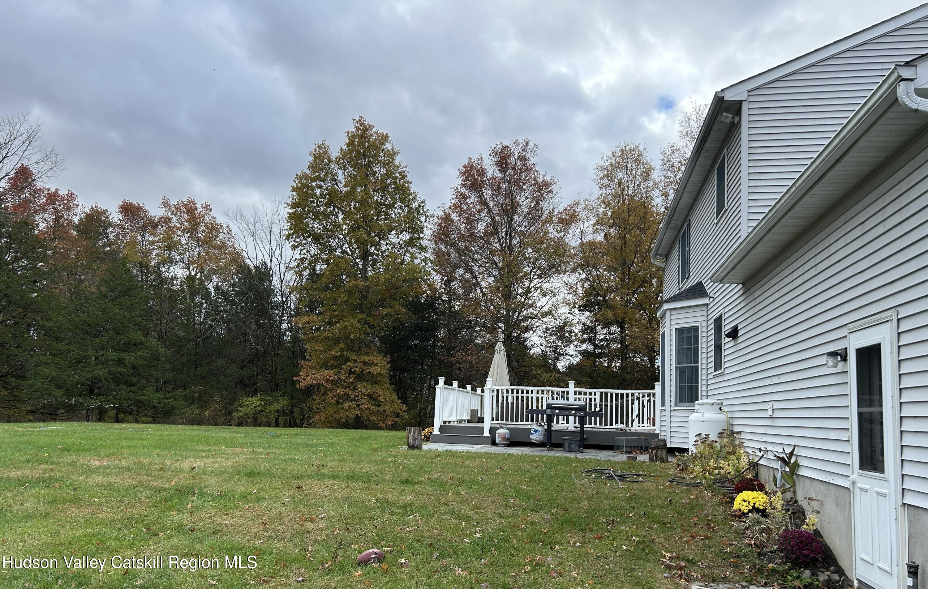 6 High Ridge Road New Paltz, NY 12561 - Photo 11 of 52 a view of a house with backyard porch and sitting area