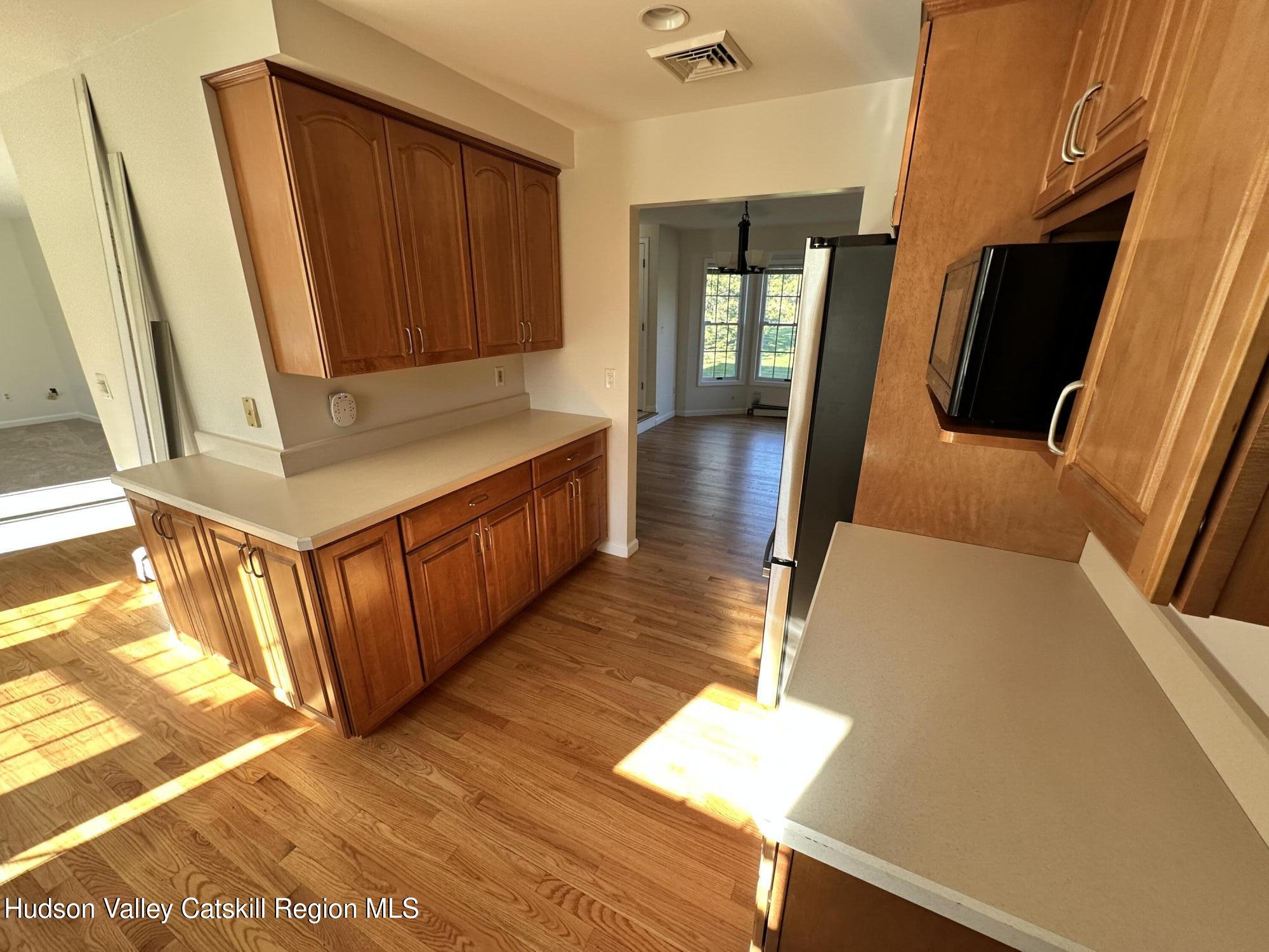 6 High Ridge Road New Paltz, NY 12561 - Photo 15 of 52 a kitchen with stainless steel appliances granite countertop a refrigerator and a stove