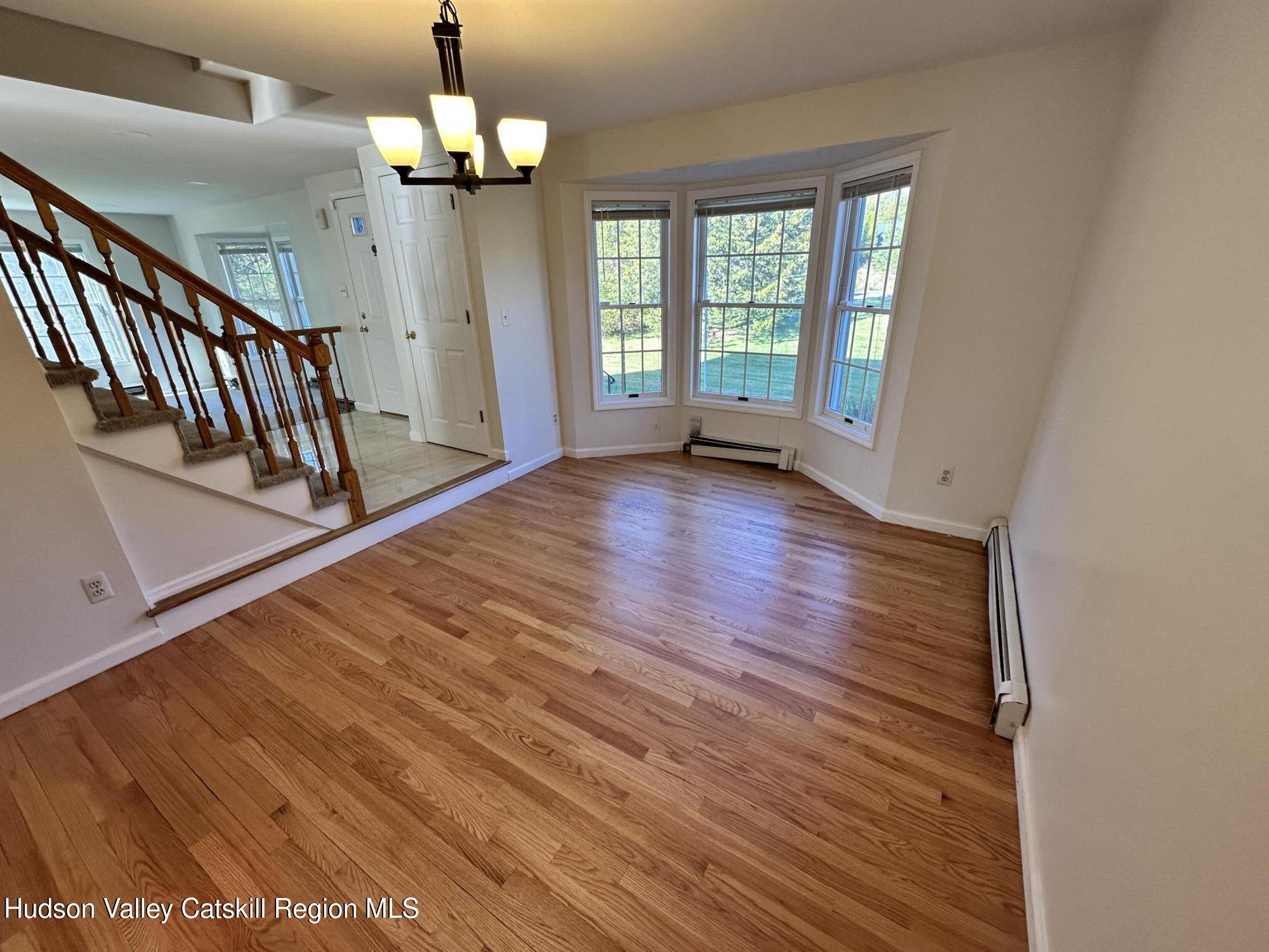 6 High Ridge Road New Paltz, NY 12561 - Photo 22 of 52 wooden floor in an empty room with a window