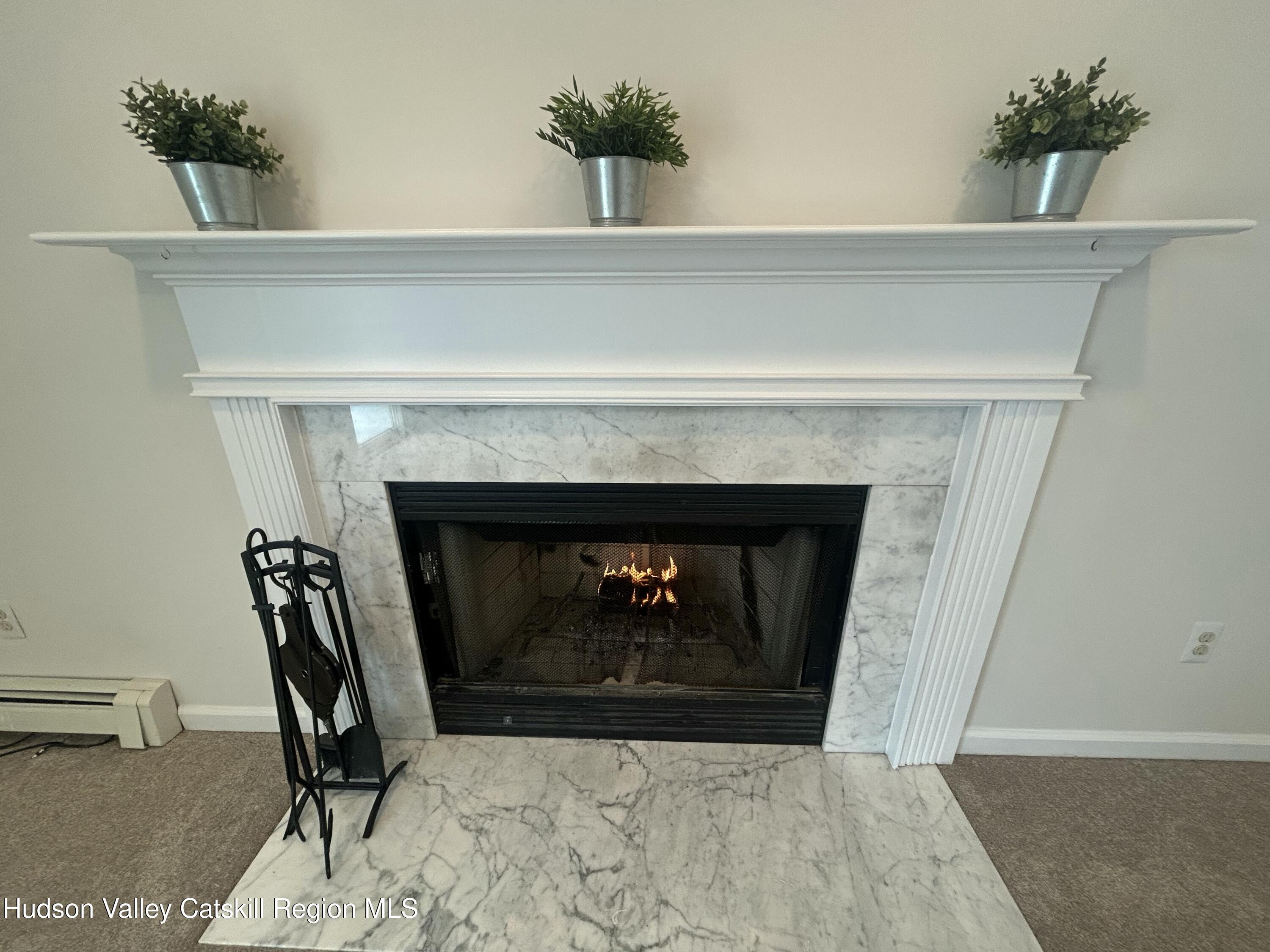 6 High Ridge Road New Paltz, NY 12561 - Photo 27 of 52 a living room with furniture and a fireplace
