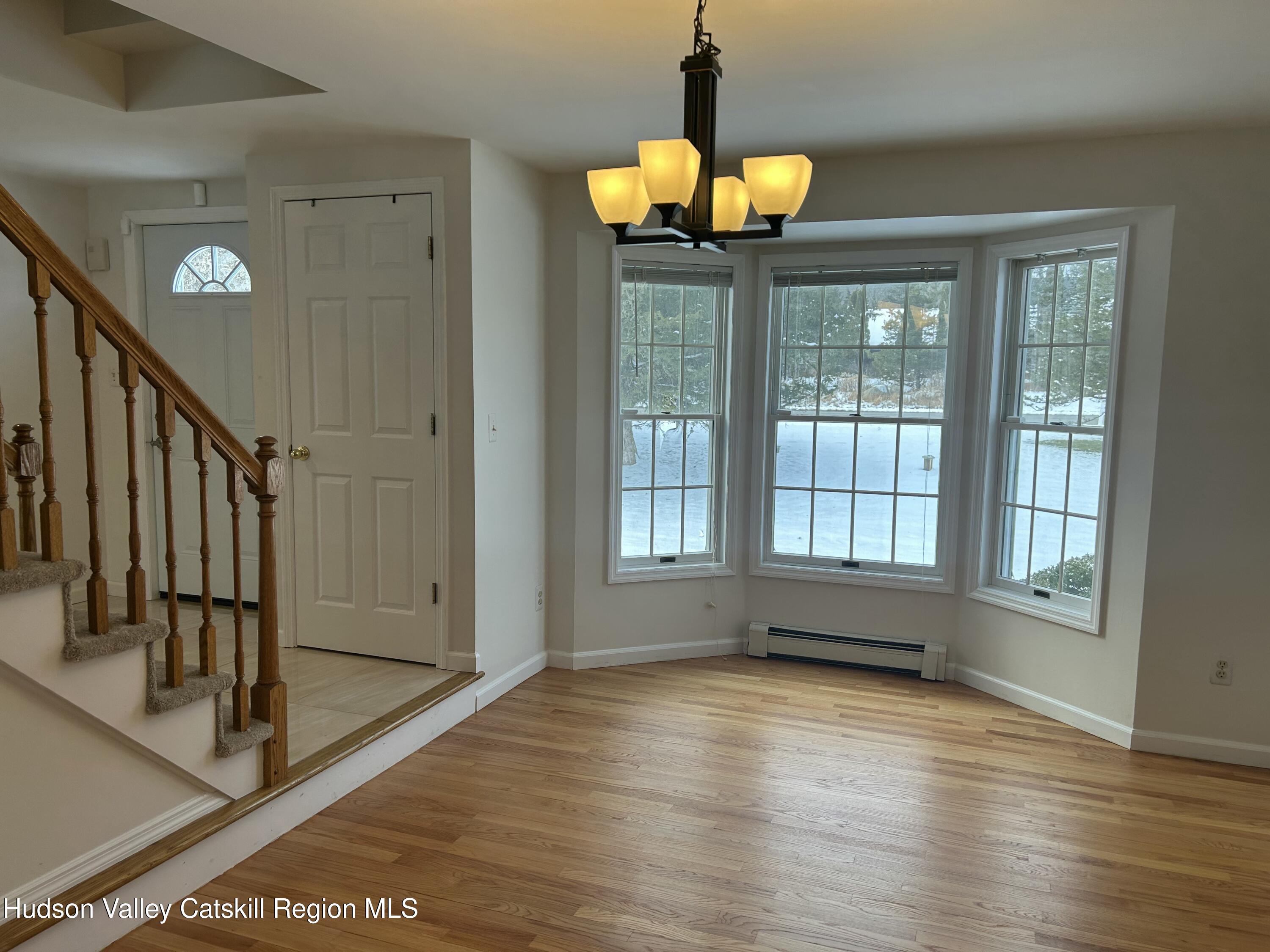 6 High Ridge Road New Paltz, NY 12561 - Photo 31 of 52 a view of an empty room with a window and wooden floor