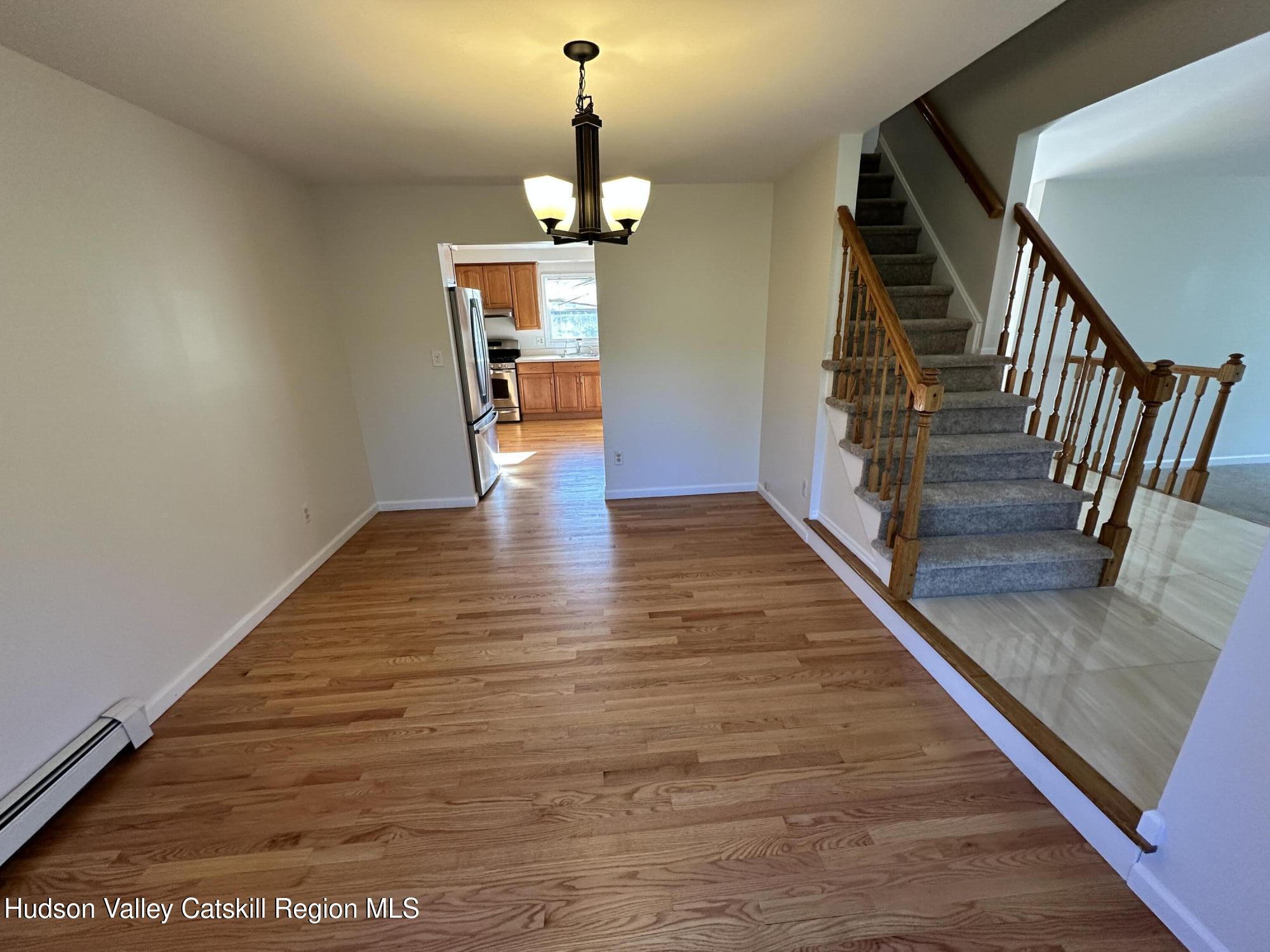 6 High Ridge Road New Paltz, NY 12561 - Photo 32 of 52 a view of entryway and hall with wooden floor