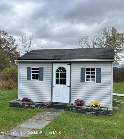 a view of a big house with a big yard