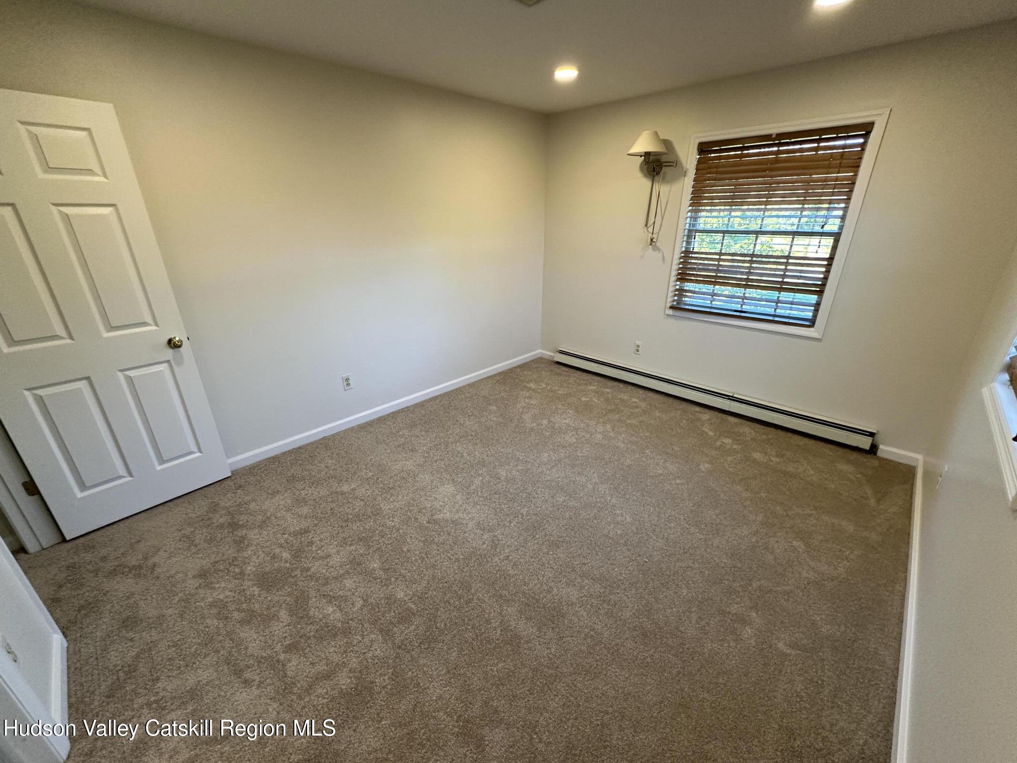 6 High Ridge Road New Paltz, NY 12561 - Photo 49 of 52 an empty room with windows