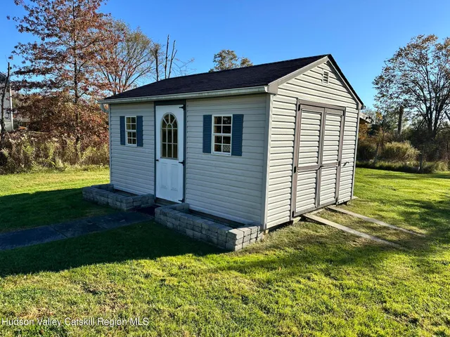a kitchen with a stove a sink a dining table and chairs