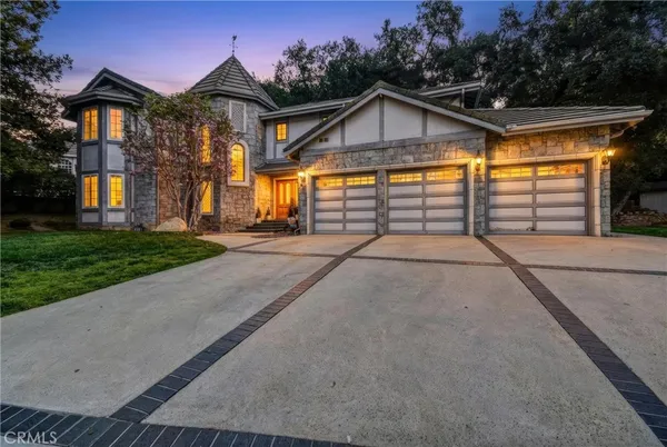 a view of an empty room with window and fireplace