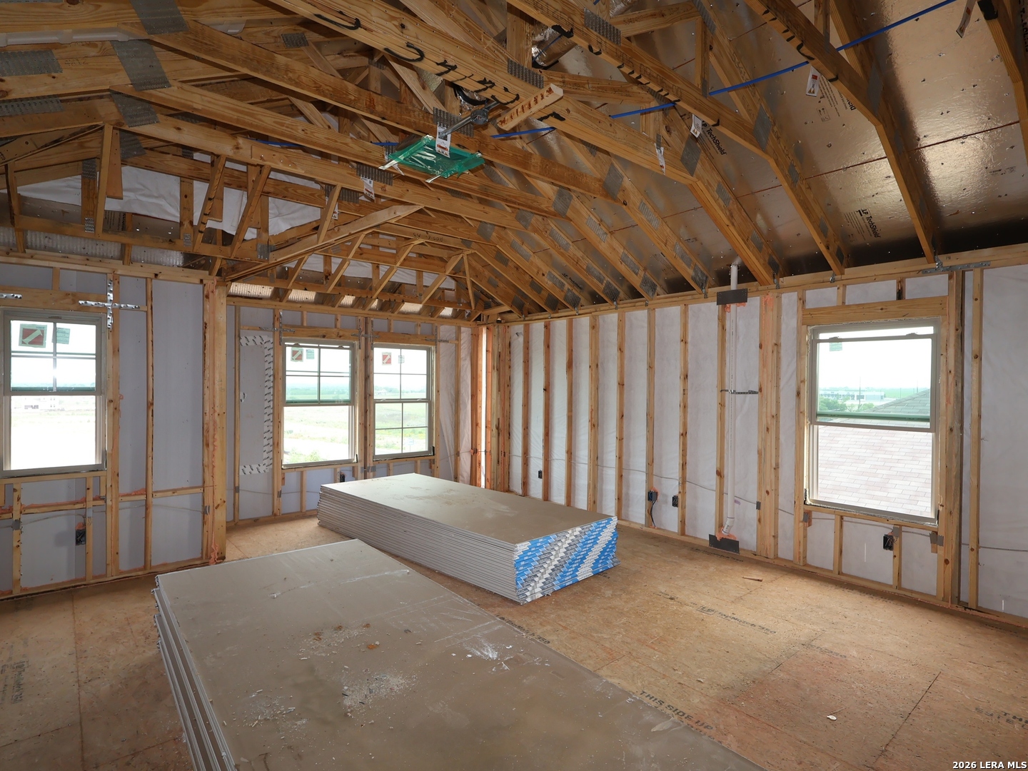2907 Selhurst Street Converse, TX 78109 - Photo 19 of 35 a spacious bedroom with a large bed and a chandelier