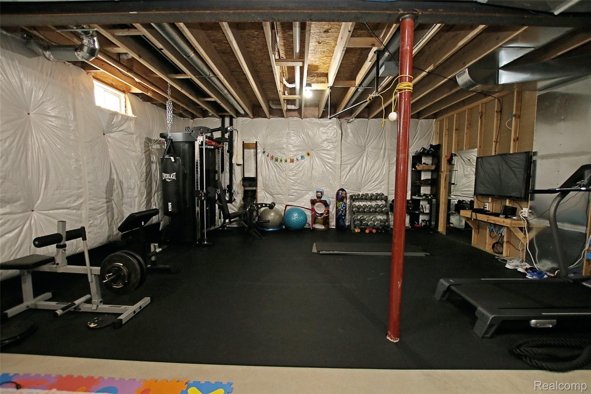 4223 Merwin Road Lapeer, MI 48446 - Photo 46 of 83 46) Lower Level Gym.jpg