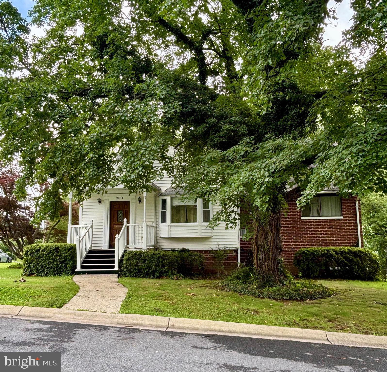 9815 Cottrell Terrace Silver Spring, MD 20903 - Photo 1 of 28 a front view of a house with a yard and garage