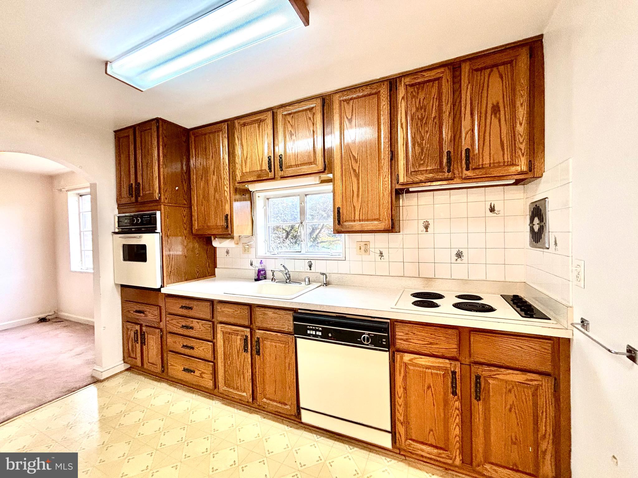 9815 Cottrell Terrace Silver Spring, MD 20903 - Photo 15 of 28 a kitchen with stainless steel appliances granite countertop a sink stove and cabinets