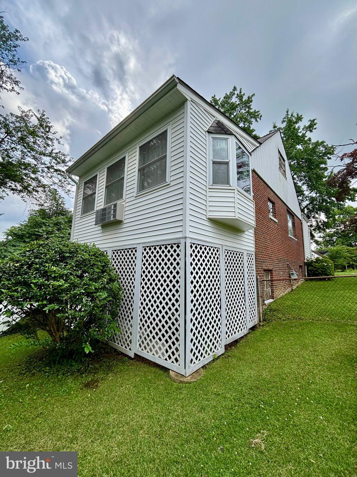 9815 Cottrell Terrace Silver Spring, MD 20903 - Photo 4 of 28 a front view of a house with garden