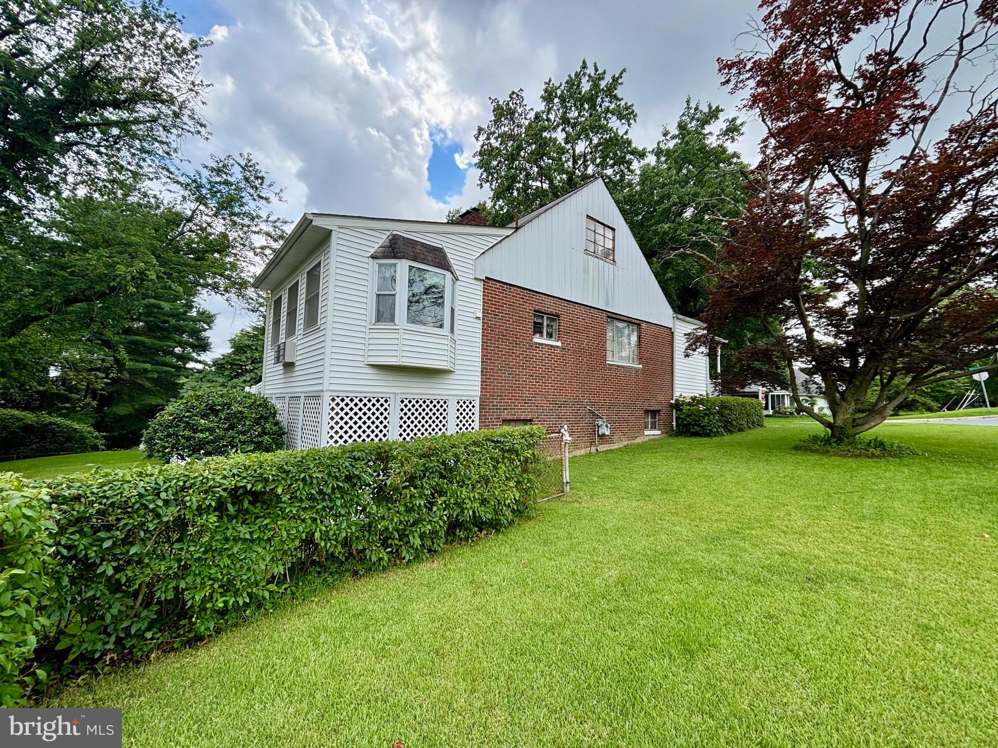 9815 Cottrell Terrace Silver Spring, MD 20903 - Photo 6 of 28 a front view of house with yard and green space