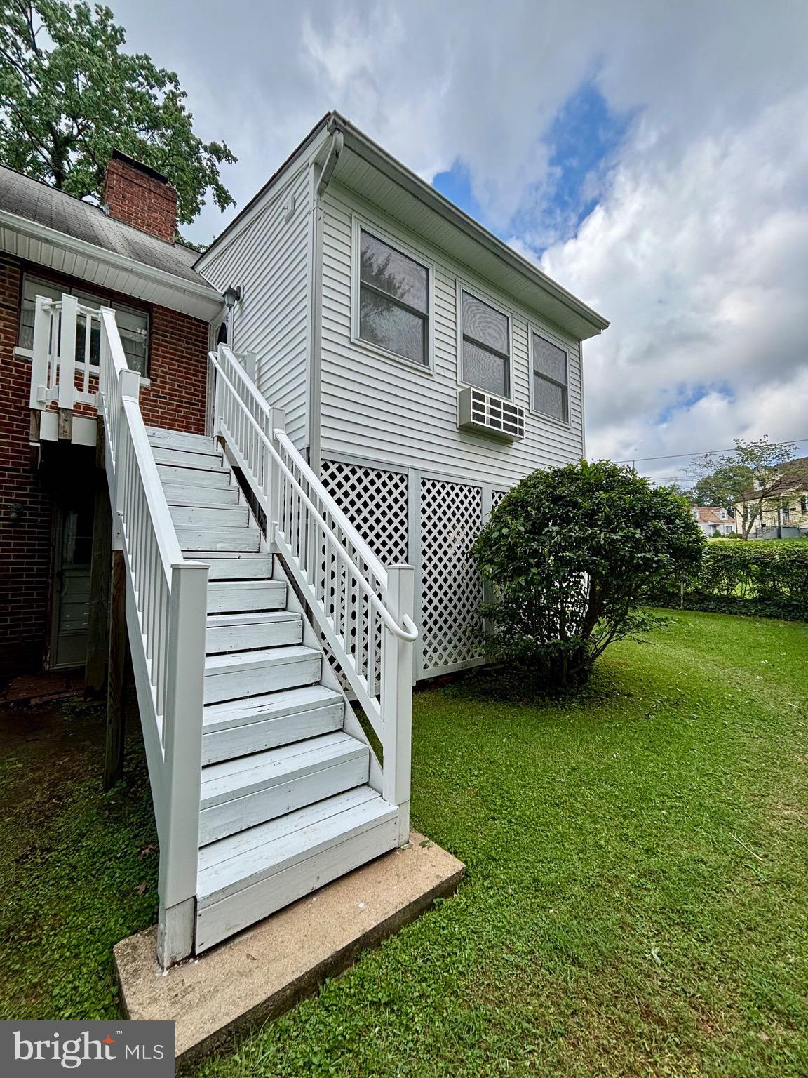 9815 Cottrell Terrace Silver Spring, MD 20903 - Photo 7 of 28 a view of a house with a yard