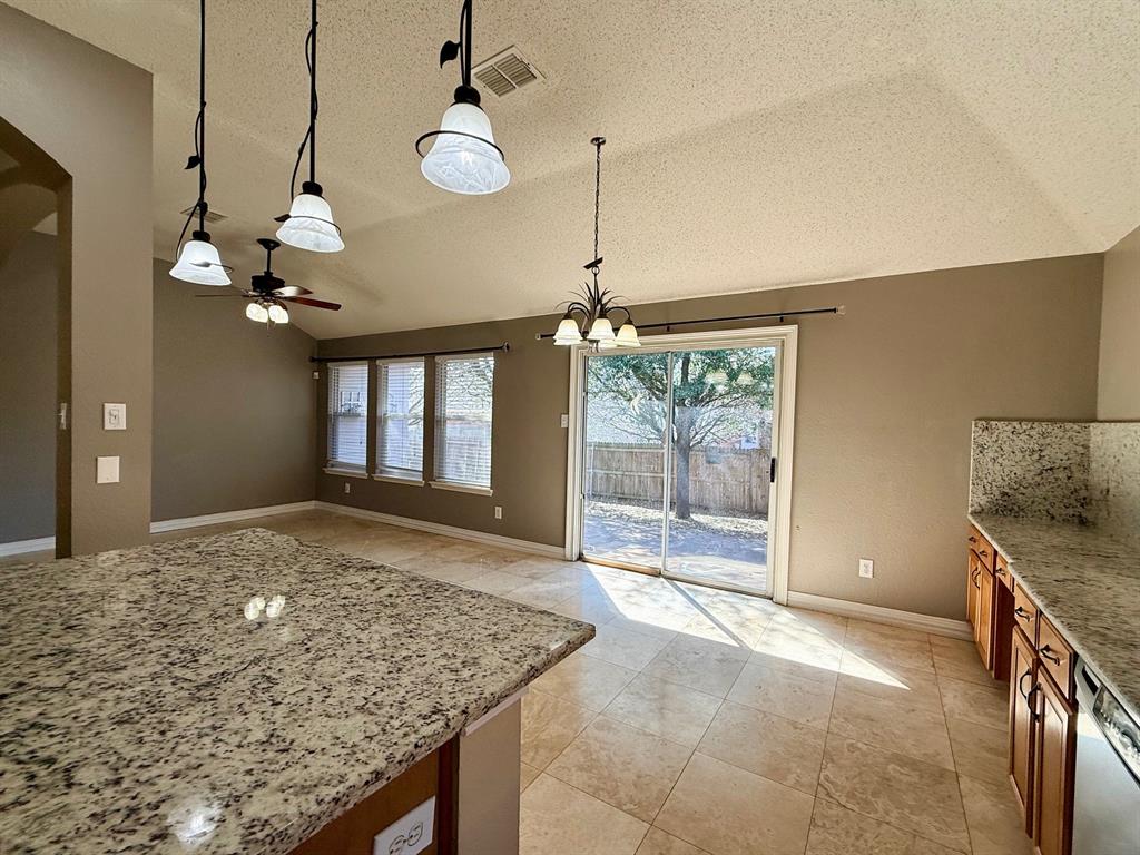 2607 Ridgeoak Trail Mansfield, TX 76063 - Photo 16 of 32 a view of a kitchen cabinet and a chandelier