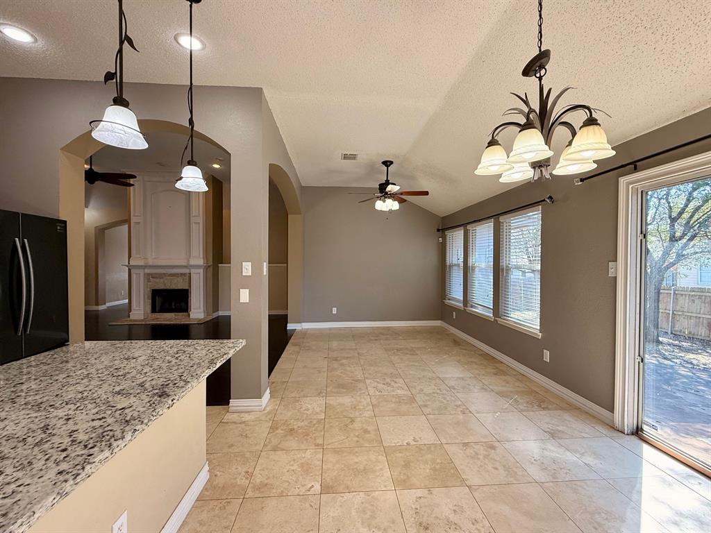 2607 Ridgeoak Trail Mansfield, TX 76063 - Photo 18 of 32 a view of a kitchen with a sink and a chandelier