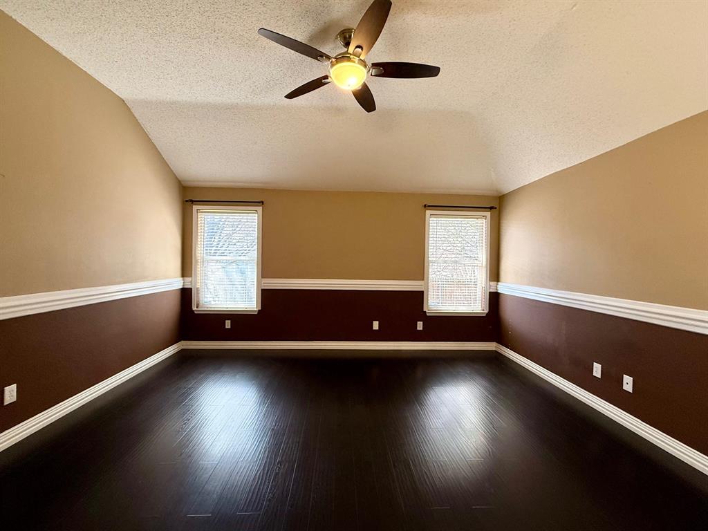 2607 Ridgeoak Trail Mansfield, TX 76063 - Photo 19 of 32 a view of an empty room with a window and wooden floor