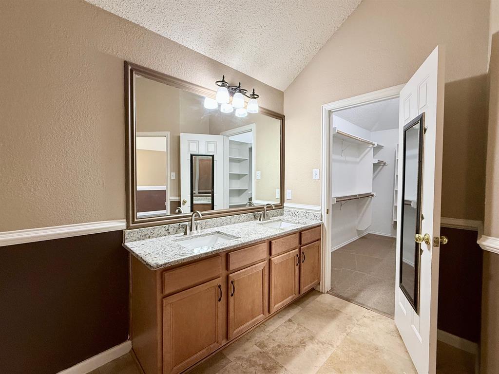 2607 Ridgeoak Trail Mansfield, TX 76063 - Photo 21 of 32 a bathroom with a granite countertop sink mirror and double