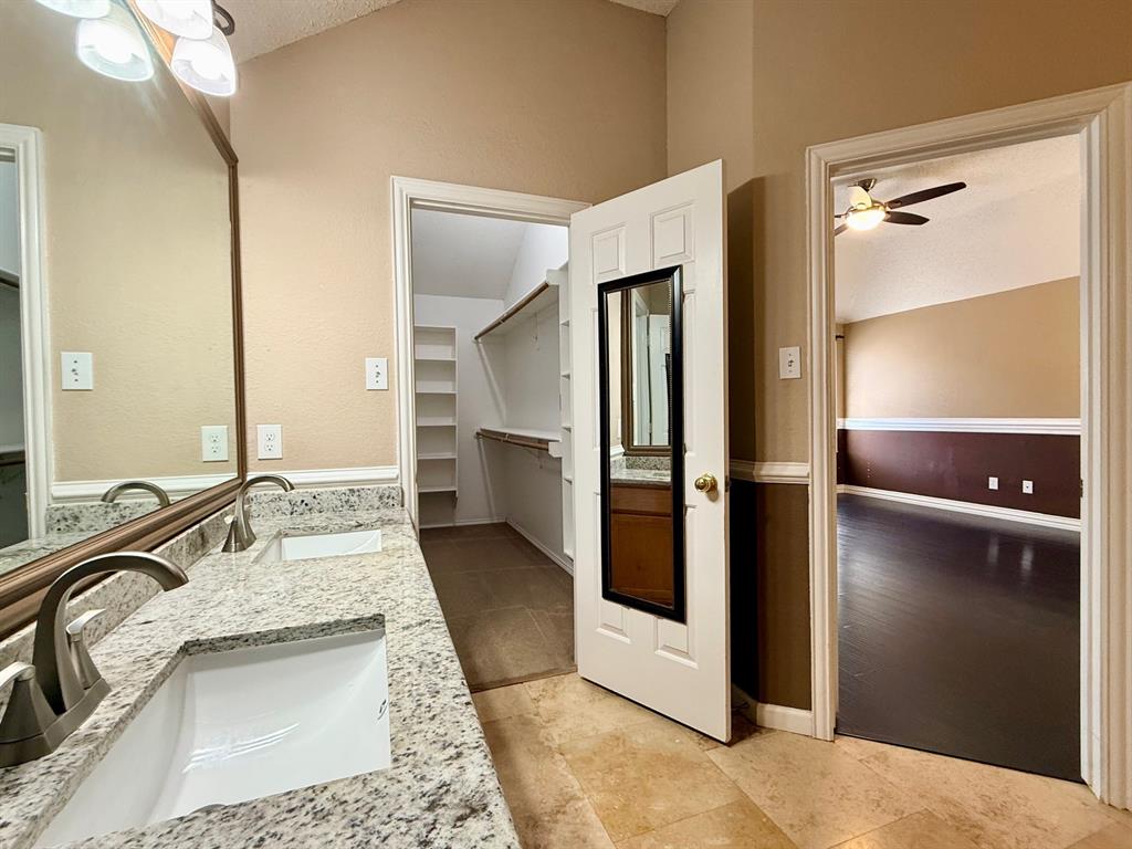 2607 Ridgeoak Trail Mansfield, TX 76063 - Photo 22 of 32 a bathroom with a sink and a mirror