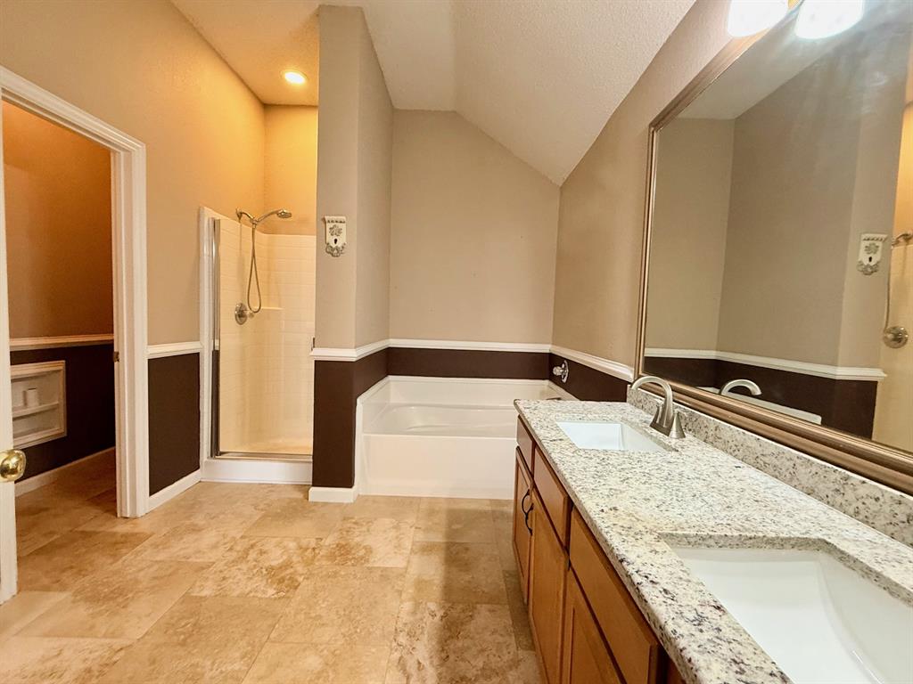 2607 Ridgeoak Trail Mansfield, TX 76063 - Photo 23 of 32 a bathroom with a granite countertop sink and a mirror