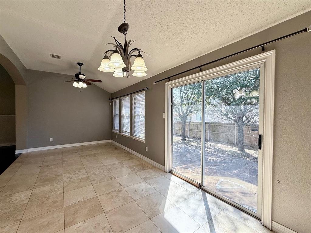 2607 Ridgeoak Trail Mansfield, TX 76063 - Photo 31 of 32 a view of a livingroom with a chandelier fan and a large window