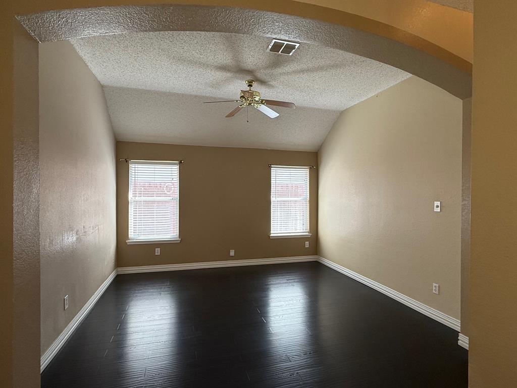 2607 Ridgeoak Trail Mansfield, TX 76063 - Photo 8 of 32 an empty room with wooden floor and windows