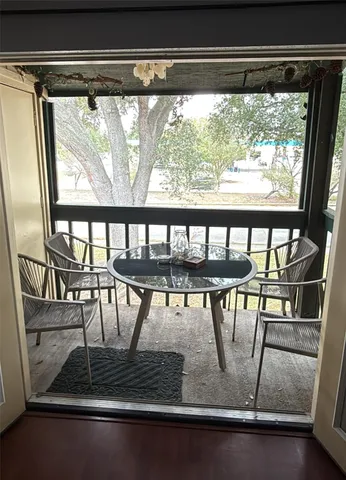 a view of a house with swimming pool and sitting area