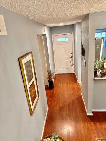 a kitchen with a sink a stove and a refrigerator