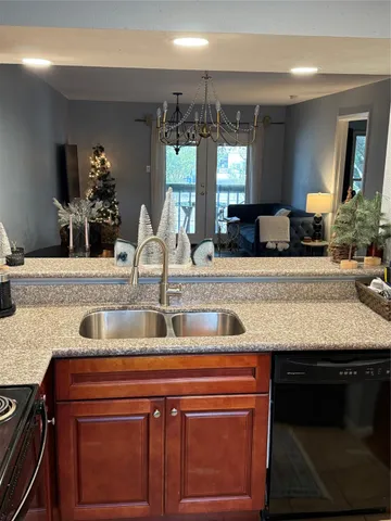 a living room with furniture and a dining table