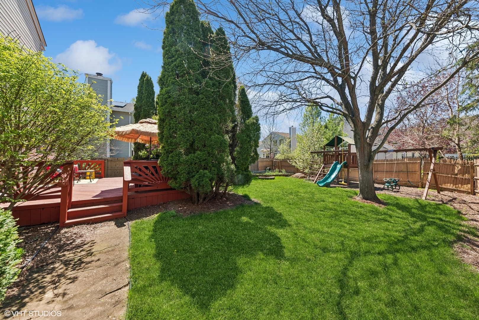 7445 Inglenook Lane Gurnee, IL 60031 - Photo 11 of 26 a view of a bench in a garden
