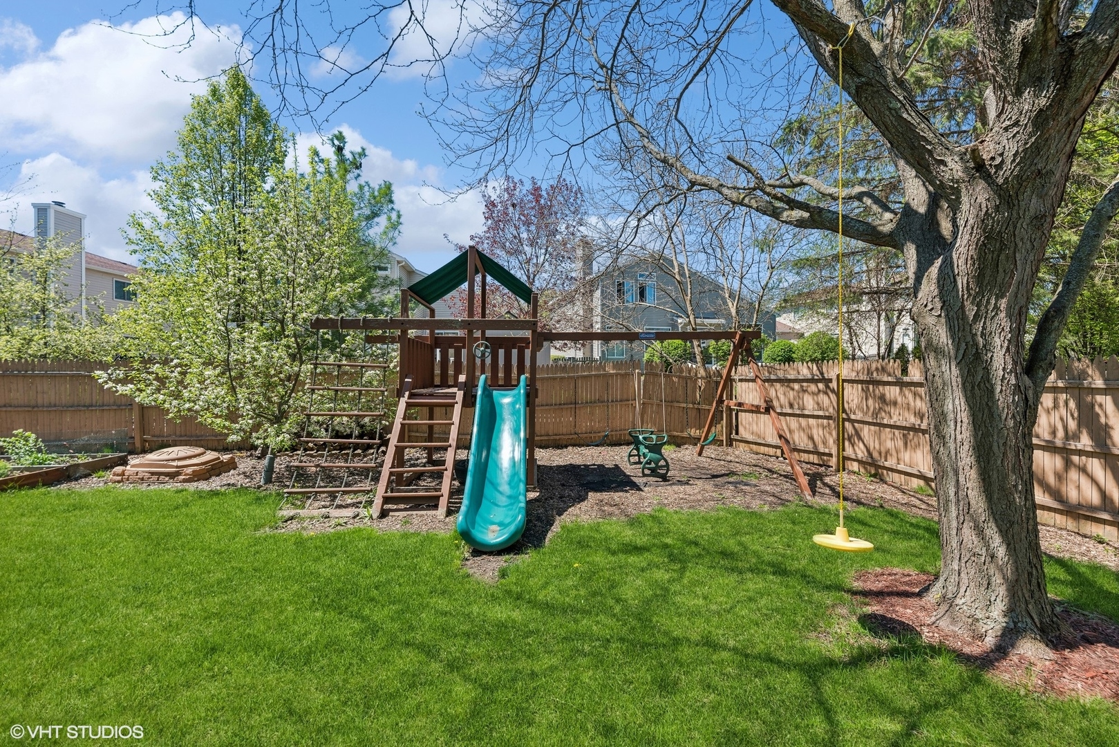 7445 Inglenook Lane Gurnee, IL 60031 - Photo 12 of 26 a view of a garden with a slide
