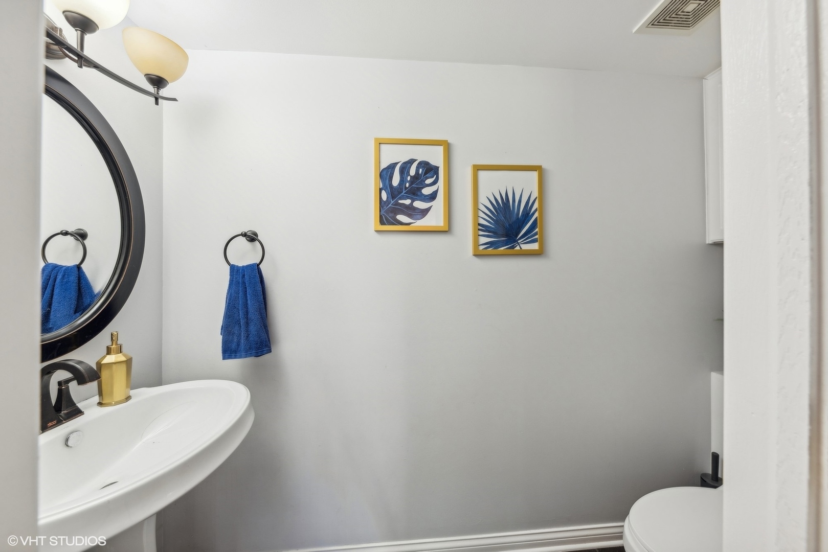 7445 Inglenook Lane Gurnee, IL 60031 - Photo 13 of 26 a bathroom with a toilet a sink and mirror