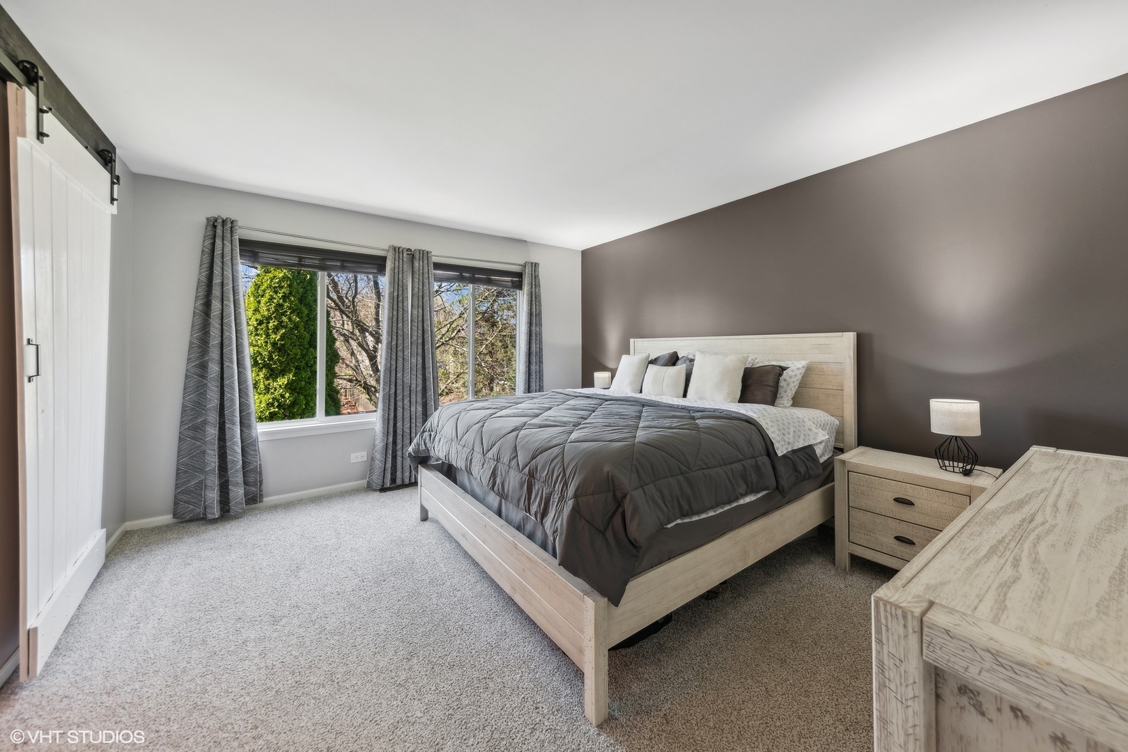 7445 Inglenook Lane Gurnee, IL 60031 - Photo 15 of 26 a spacious bedroom with a bed and large windows