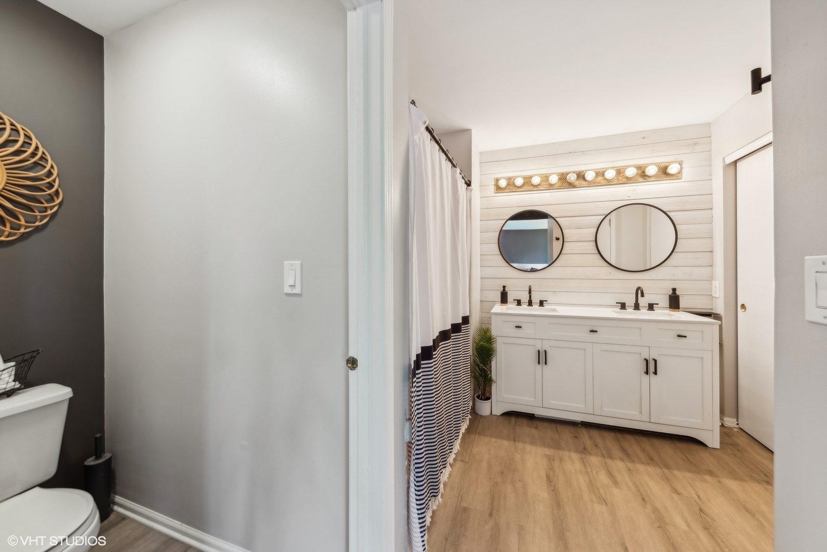 7445 Inglenook Lane Gurnee, IL 60031 - Photo 16 of 26 a bathroom with a toilet a sink and a mirror