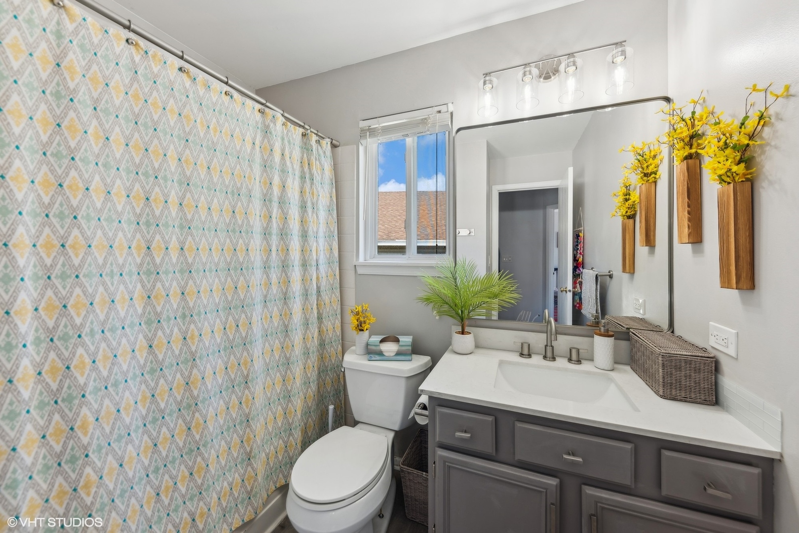 7445 Inglenook Lane Gurnee, IL 60031 - Photo 19 of 26 a bathroom with a granite countertop sink a toilet and mirror