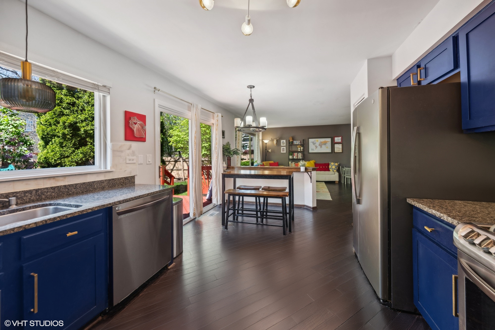 7445 Inglenook Lane Gurnee, IL 60031 - Photo 6 of 26 a kitchen with stainless steel appliances granite countertop a refrigerator and a wooden floors