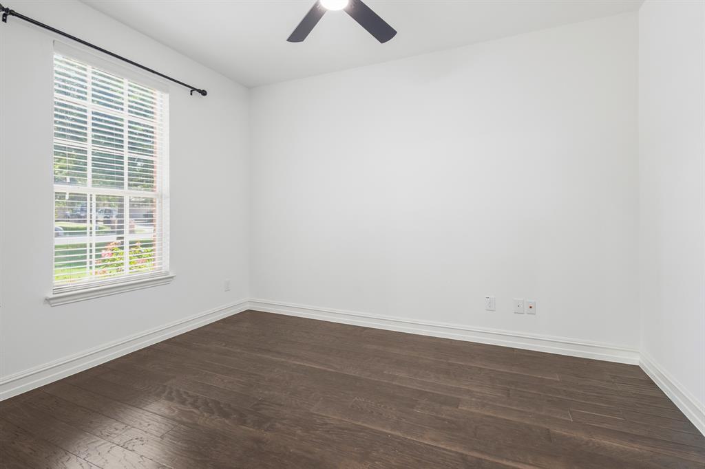 1995 Verde Court Allen, TX 75013 - Photo 23 of 30 Spacious room featuring wood-finish flooring, white baseboards, and a large multi-pane window with white blinds