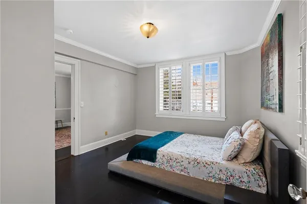 a bedroom with bed and window